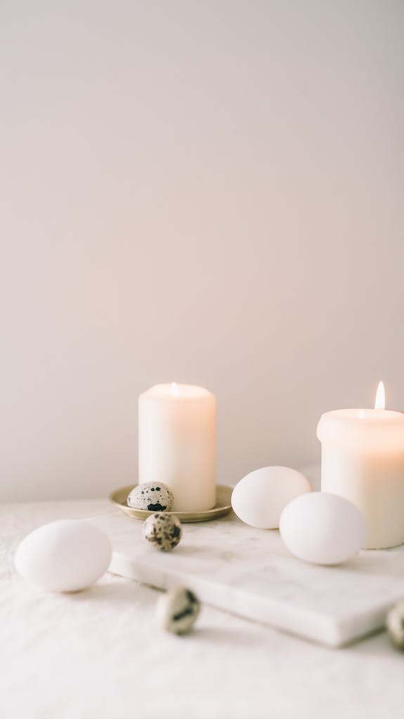 Eggs And Lighted Candle On Table