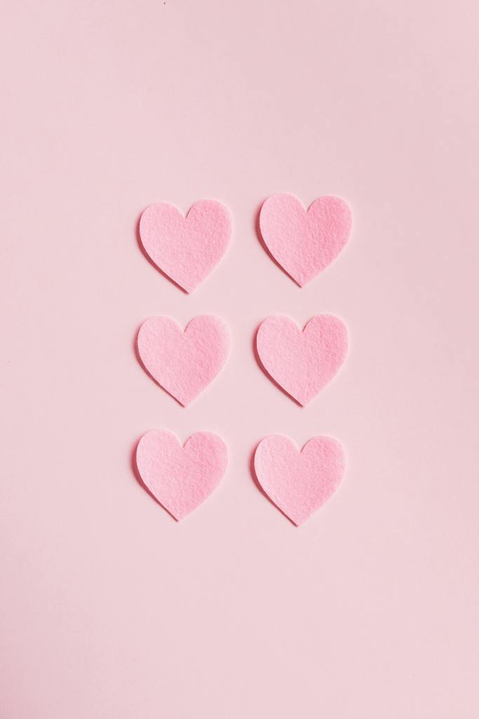 Heart Shaped Cutouts on Pink Background