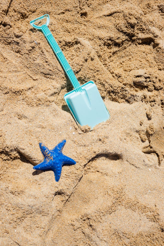 Photograph of Toys on Brown Sand