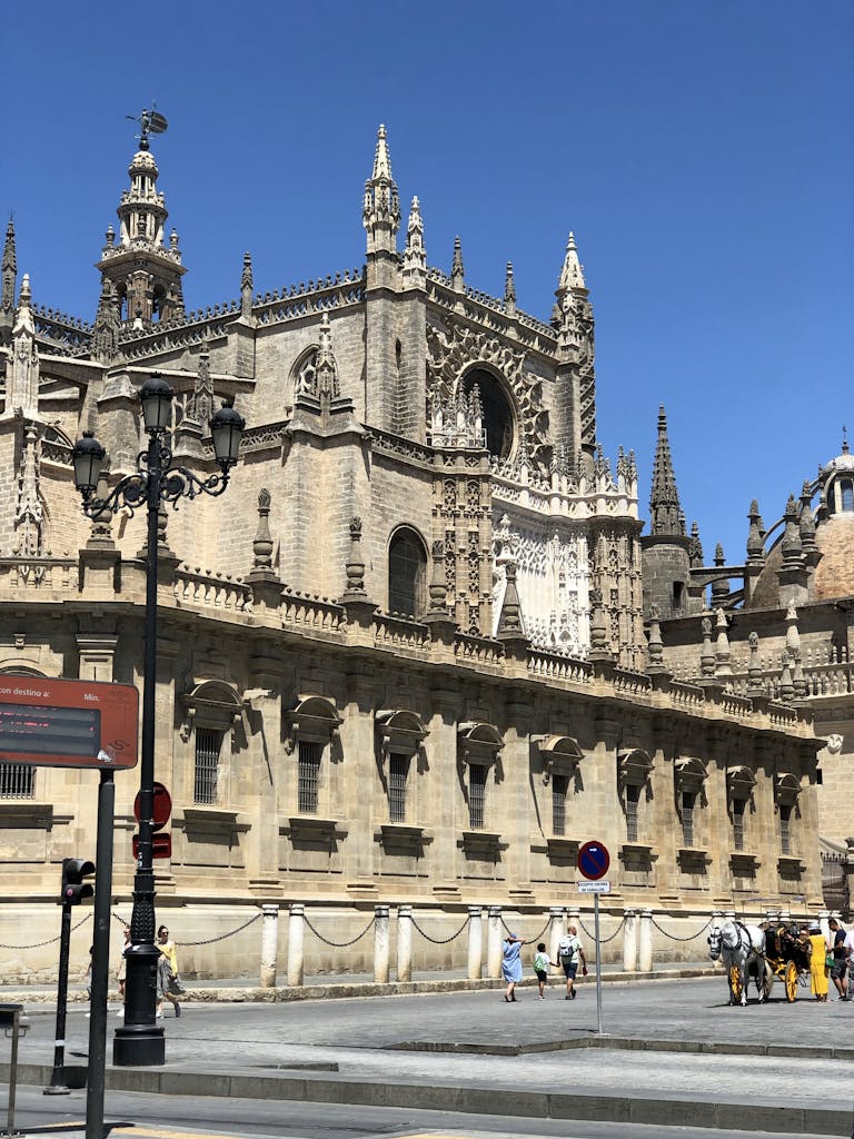 People Walking Beside a Cathedral